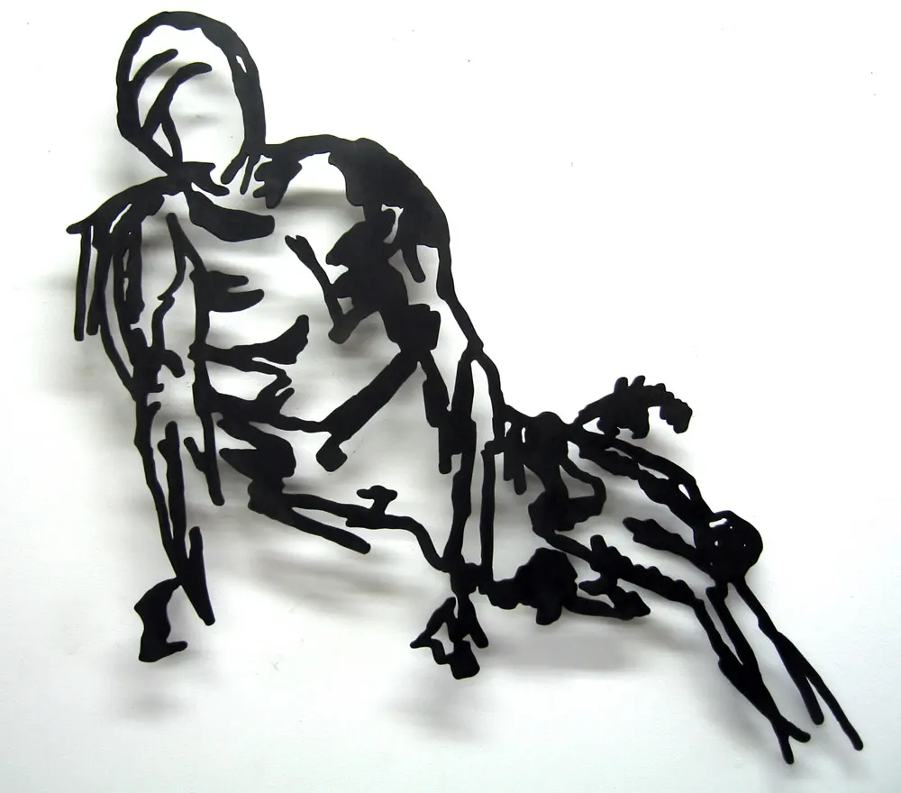 Metal sketch of a model laying prone